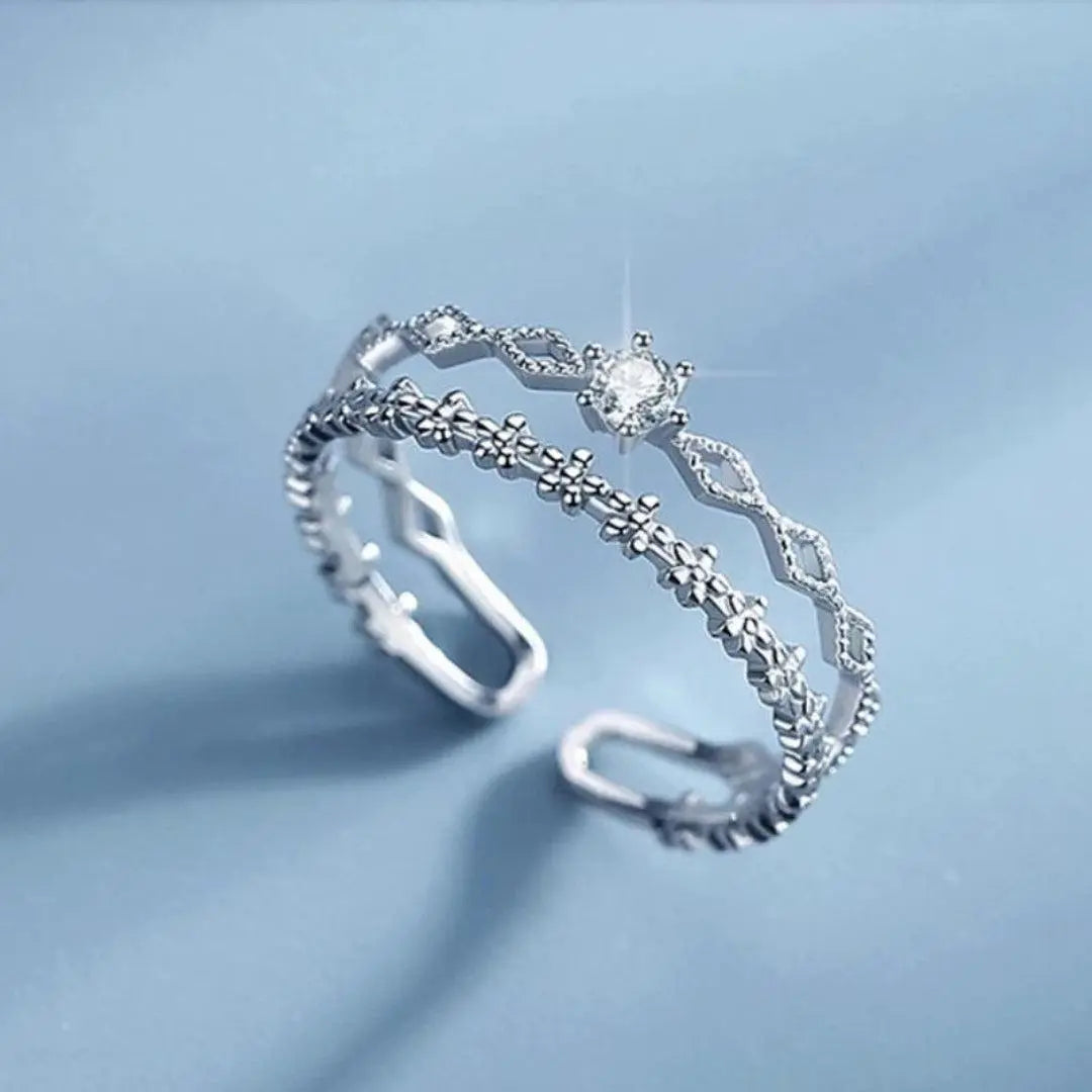 Anello elegante regolabile con zirconi in argento sterling