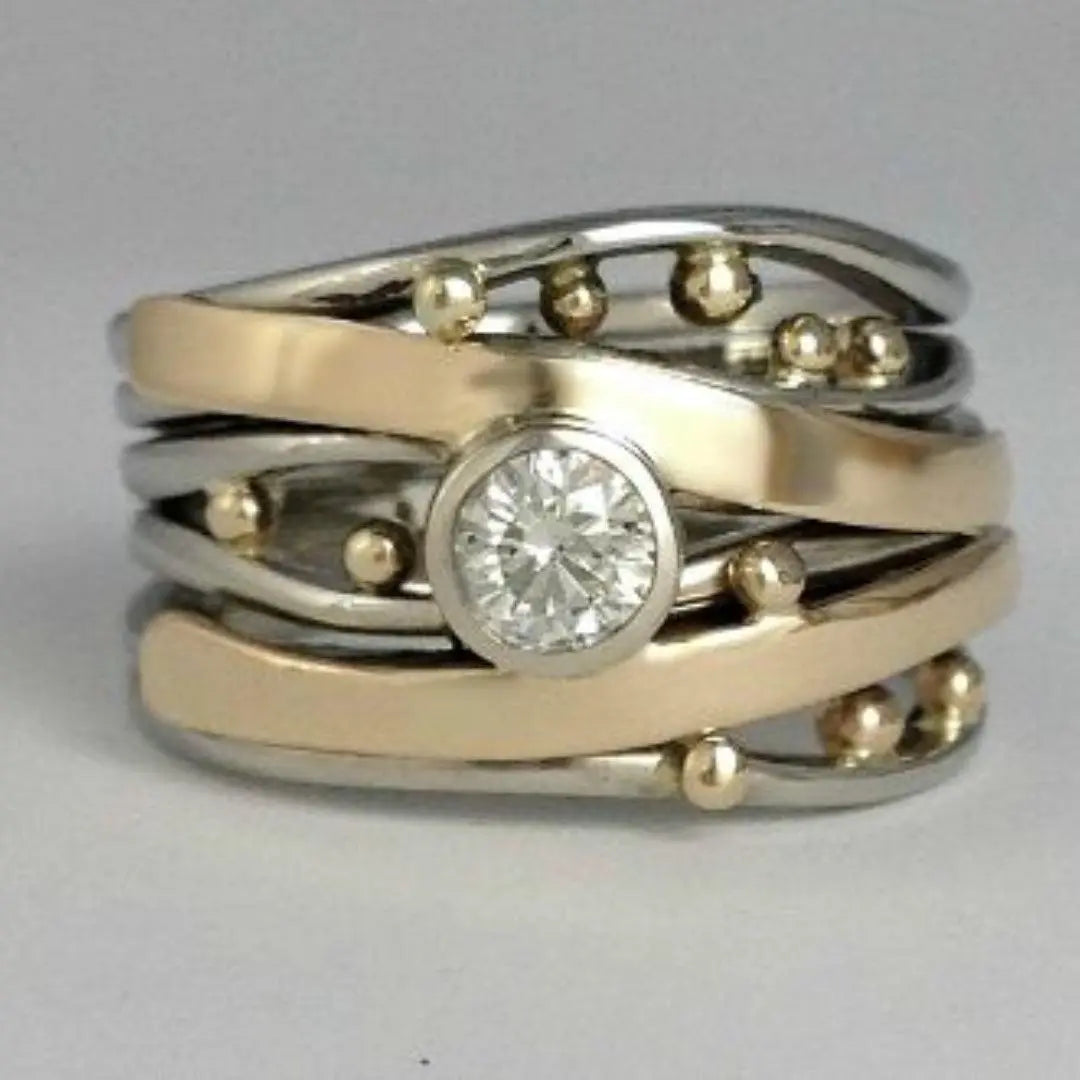 Anello in oro vintage con incastonature di zirconia