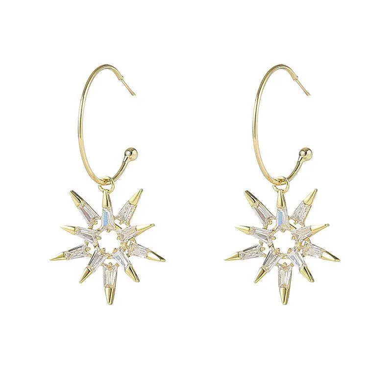 Orecchini a stella in oro e argento