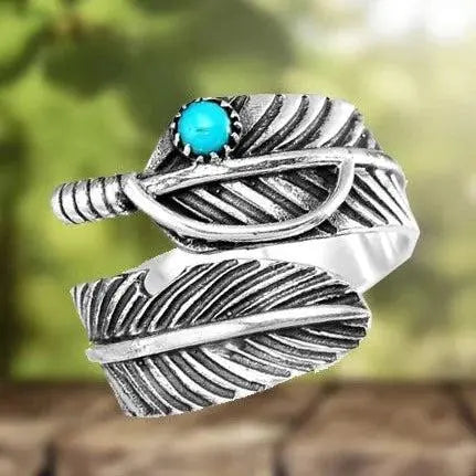 Anello regolabile con piuma boho e turchese