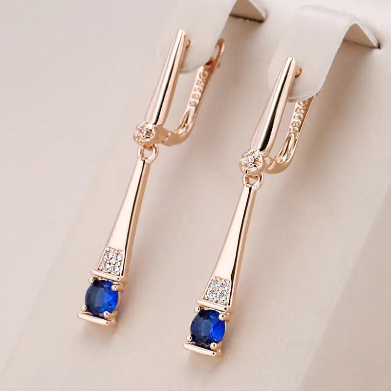 Orecchini con pendente in cristallo blu e oro