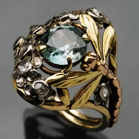 Anello floreale con cristallo blu in oro vintage