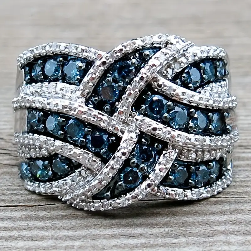 Anello luminoso intrecciato blu argento