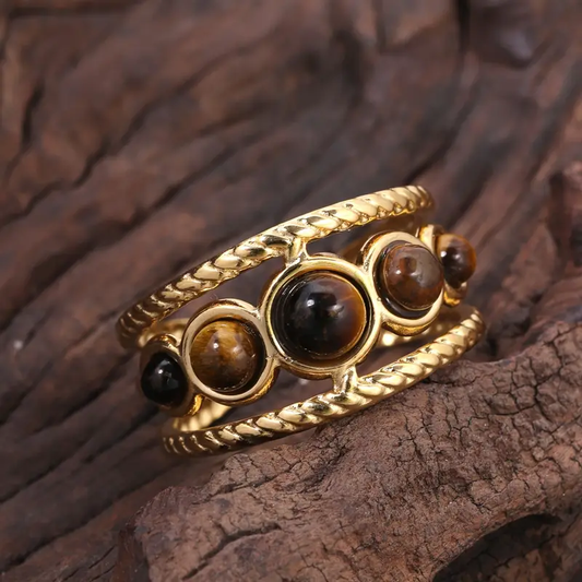 Anello in pietra marrone con finitura dorata