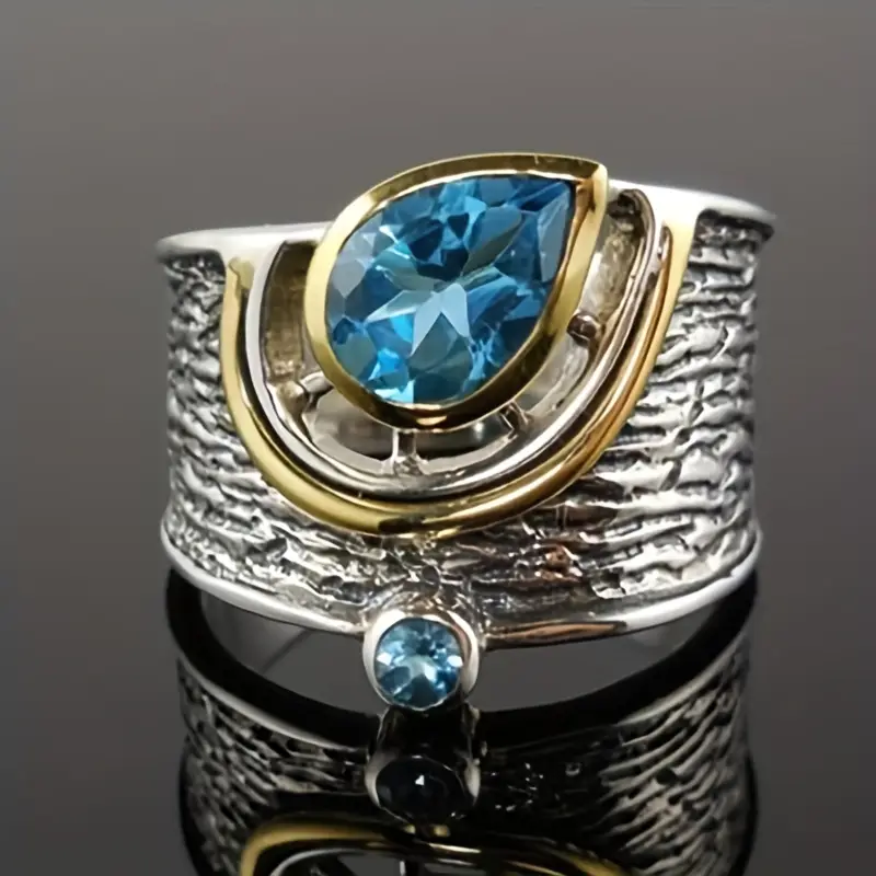 Anello in argento e oro con cristalli blu