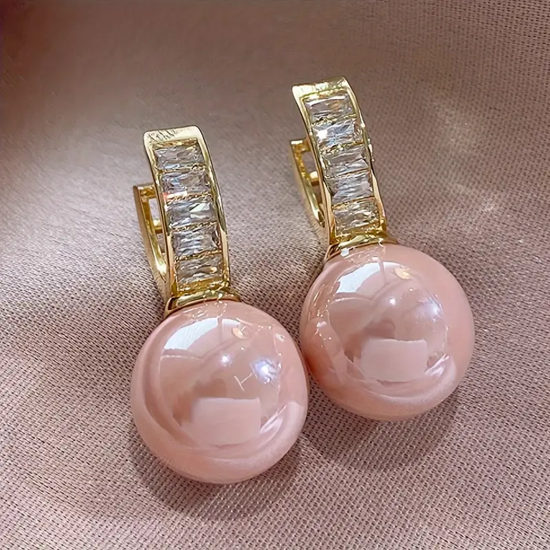 Orecchini in oro con zirconia rosa perla