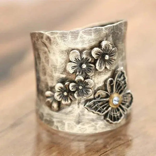 Anello a banda larga con fiore di farfalla e api
