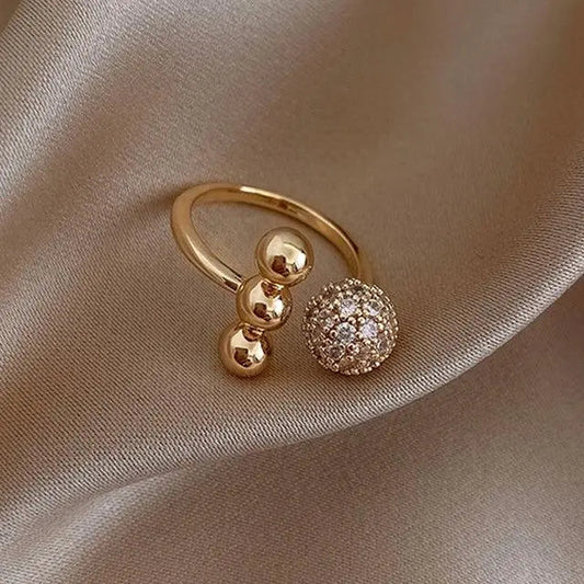 Anello a Tre Sfere in Oro e Dioxide di Zirconio