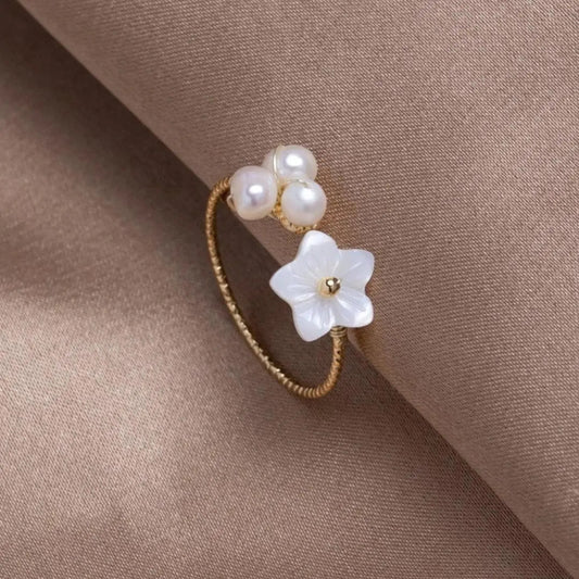 Anello regolabile con perla e fiore in oro