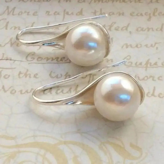 Orecchini pendenti eleganti con perle