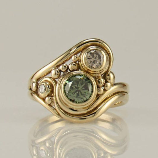 Anello vintage in oro con zircone verde