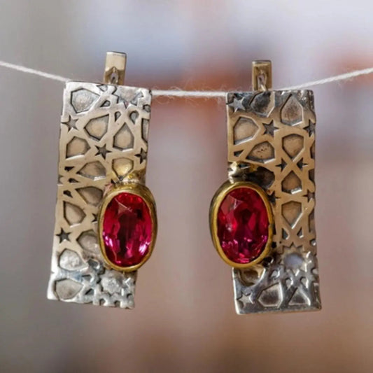 Orecchini vintage in oro e argento con zirconi rossi