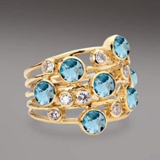 Anello vintage in oro con molte pietre di zirconia blu e bianche