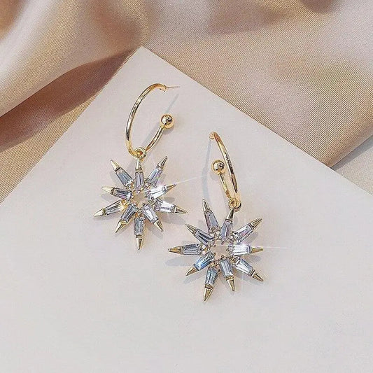 Orecchini a stella in oro e argento