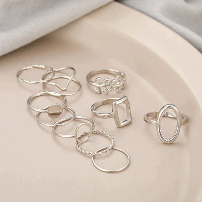 Set con 11 anelli vintage in argento