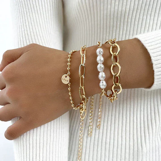 Set di bracciali con perline d'oro