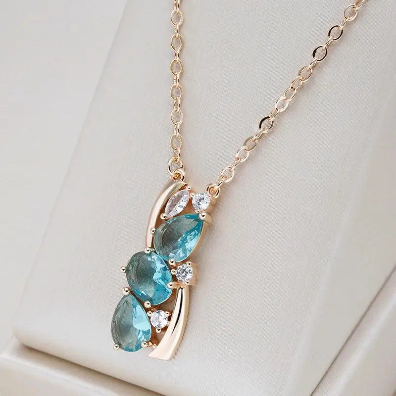 Collana elegante in cristallo blu con fiocco in oro