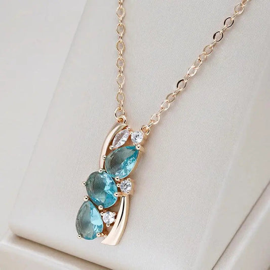 Collana elegante in cristallo blu con fiocco in oro