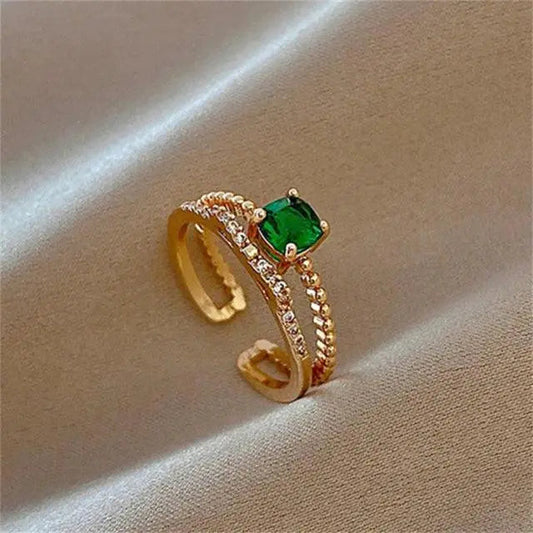 Anello regolabile con zircone verde in oro