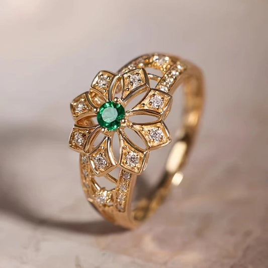Anello d'oro vuoto con fiore e pietra verde