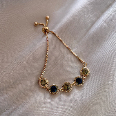 Bracciale con cristalli verdi in oro