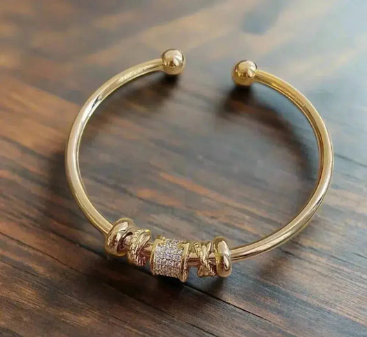 Braccialetto regolabile con charms dorati