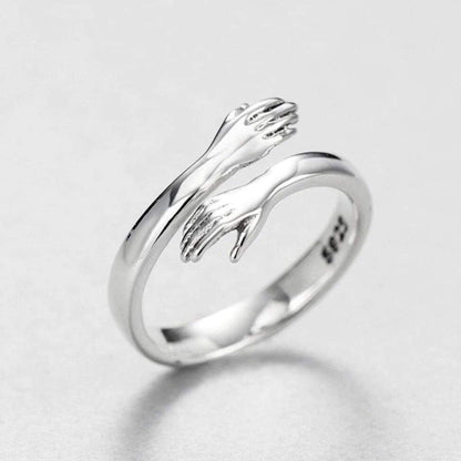 Anello regolabile a forma di abbraccio in argento