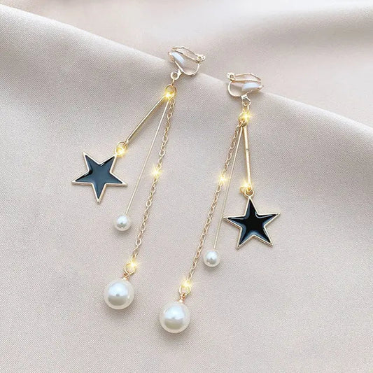 Orecchini eleganti con stelle scintillanti e perle