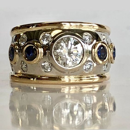 Anello di oro nobile con zirconi e cristalli blu