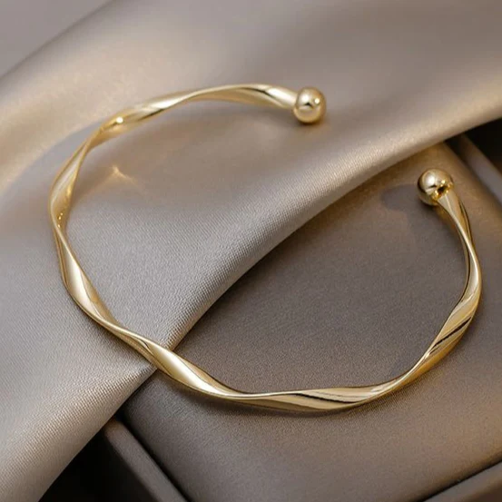Bracciale aperto dorato elegante