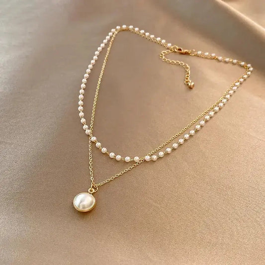 Collana elegante con perle in oro