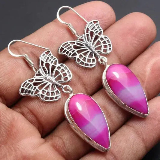 Orecchini vintage a farfalla con pietra rosa