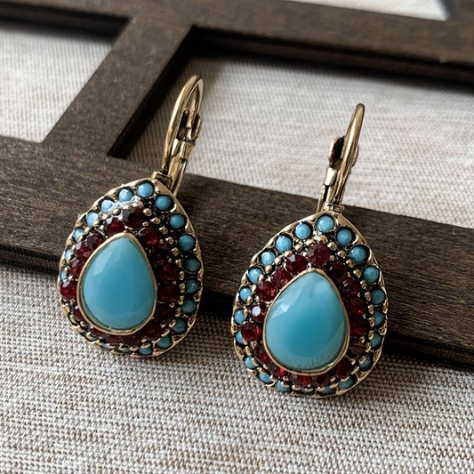 Orecchini d'oro con pendente in opale blu
