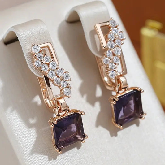 Orecchini con eleganti cristalli scuri placcati oro