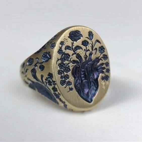 Anello vintage in oro con sigillo floreale blu