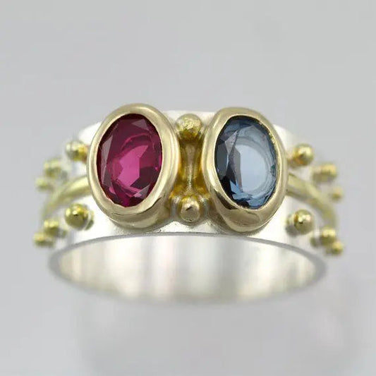 Anello vintage con cristalli blu e rosso