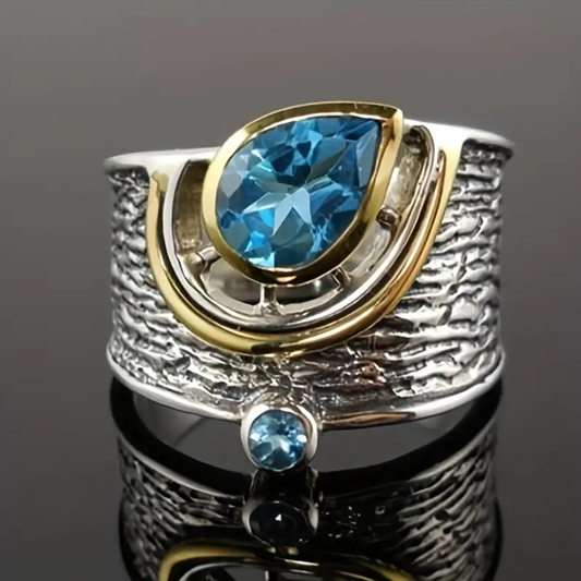 Anello in argento e oro con cristalli blu