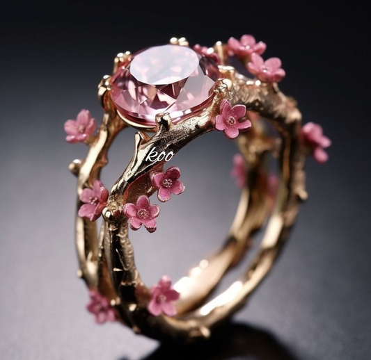 Incantatore anello d'oro con cristallo rosa e piccoli fiori