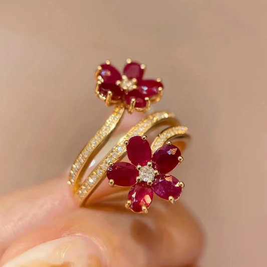 anello spirale dorato con gerbere rosse