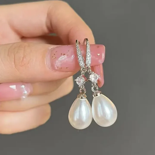 Orecchini pendenti brillanti con perle